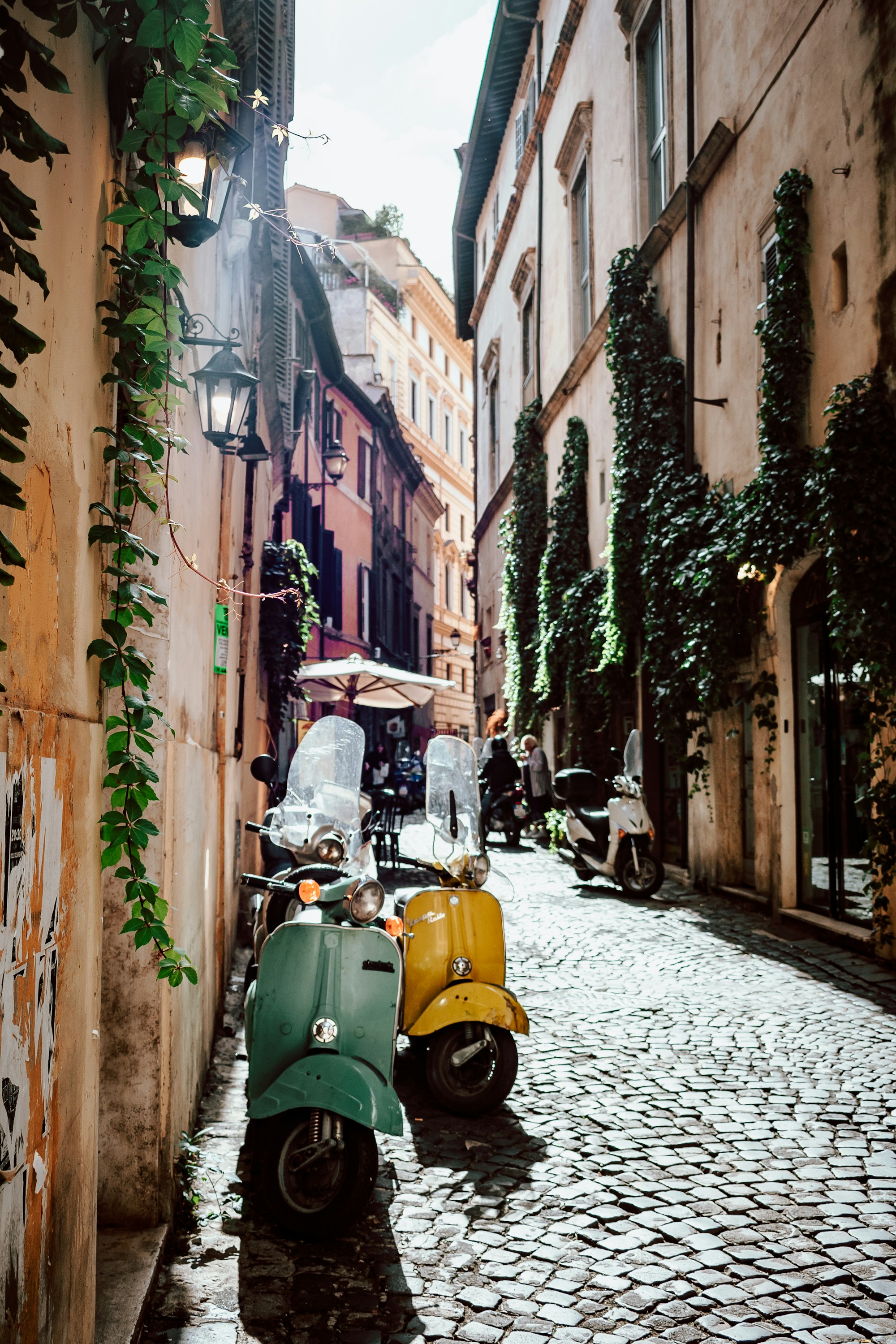 A scooter against a warm Italian wall